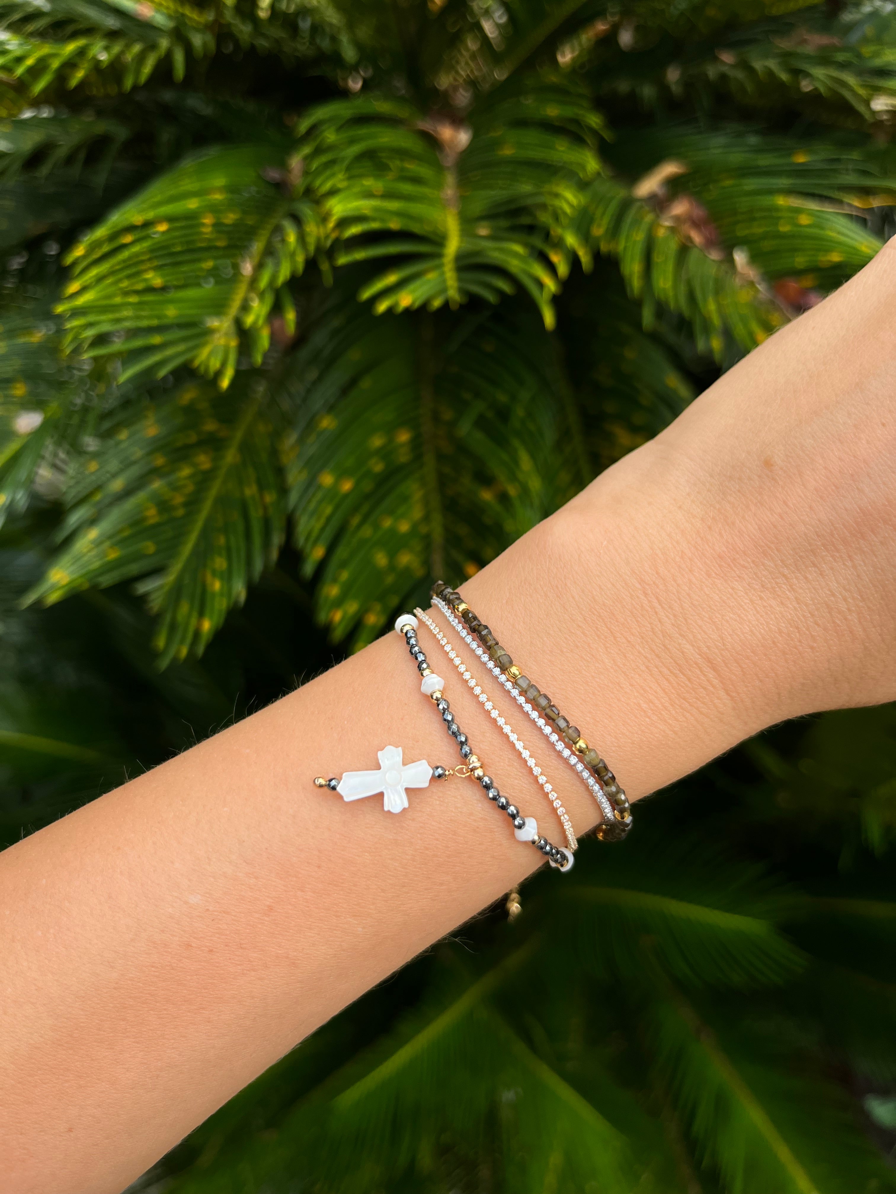 PULSEIRA CRUZ MADREPÉROLA HEMATITA OURO