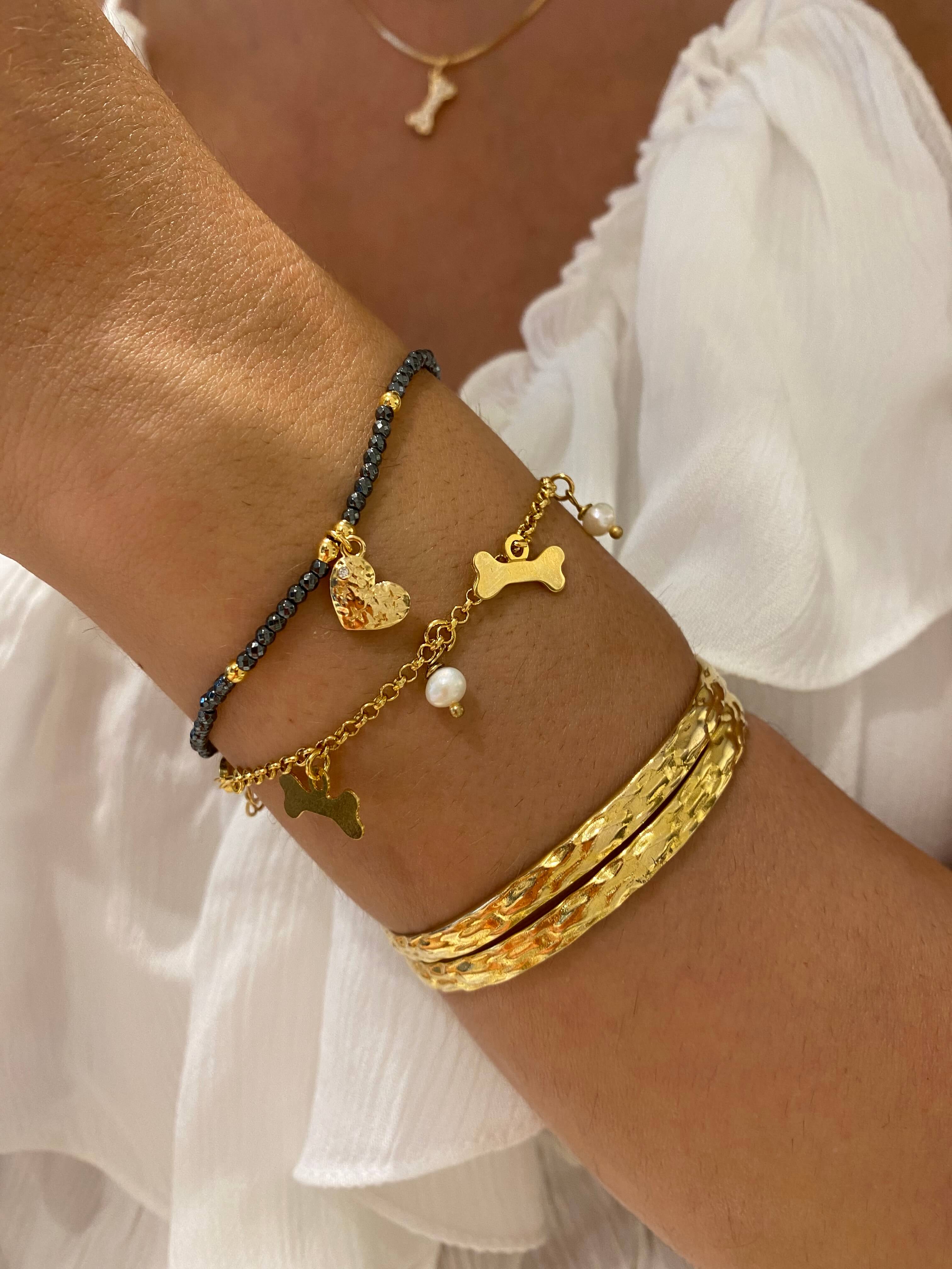 PULSEIRA PÉROLA E OSSINHO OURO