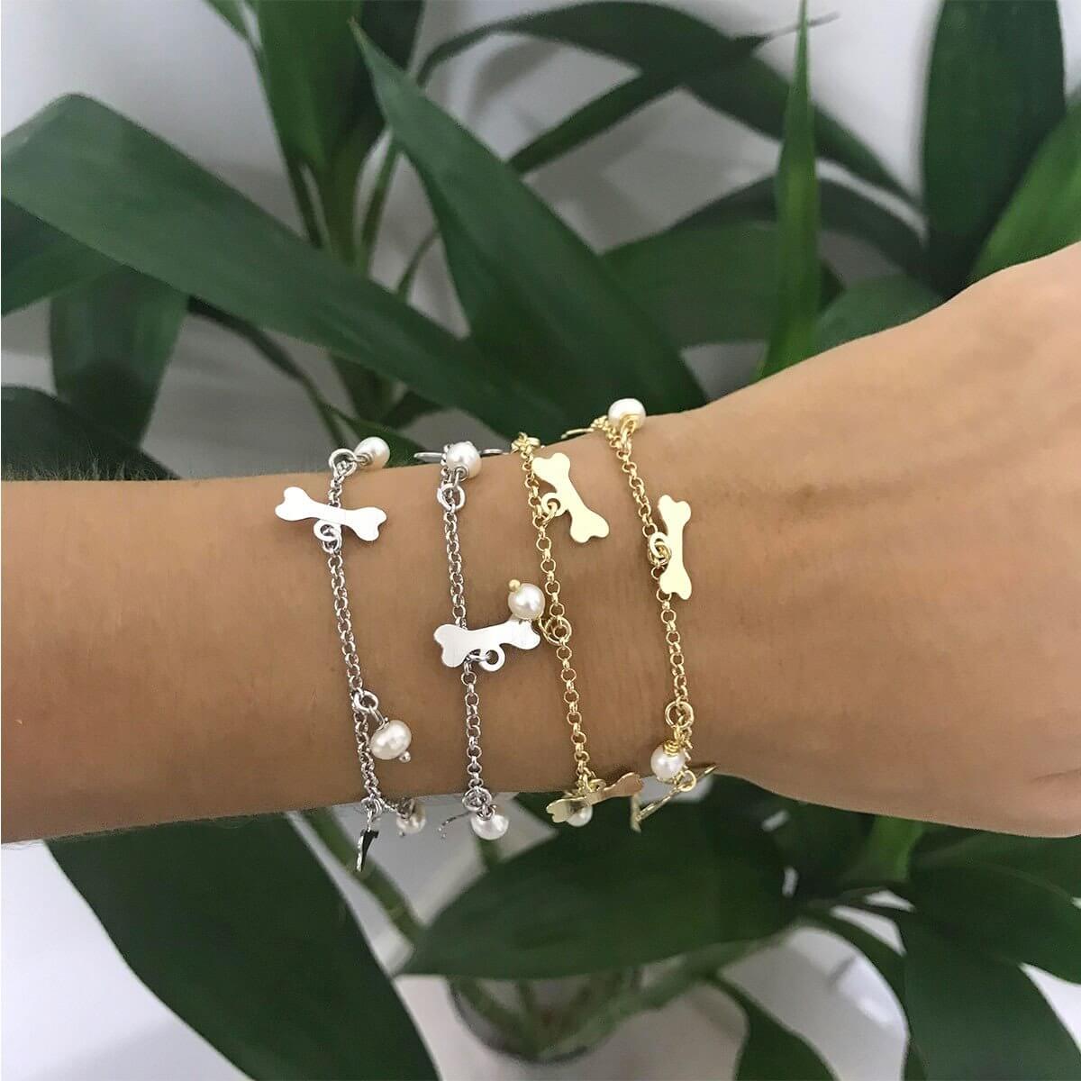 PULSEIRA PÉROLA E OSSINHO OURO