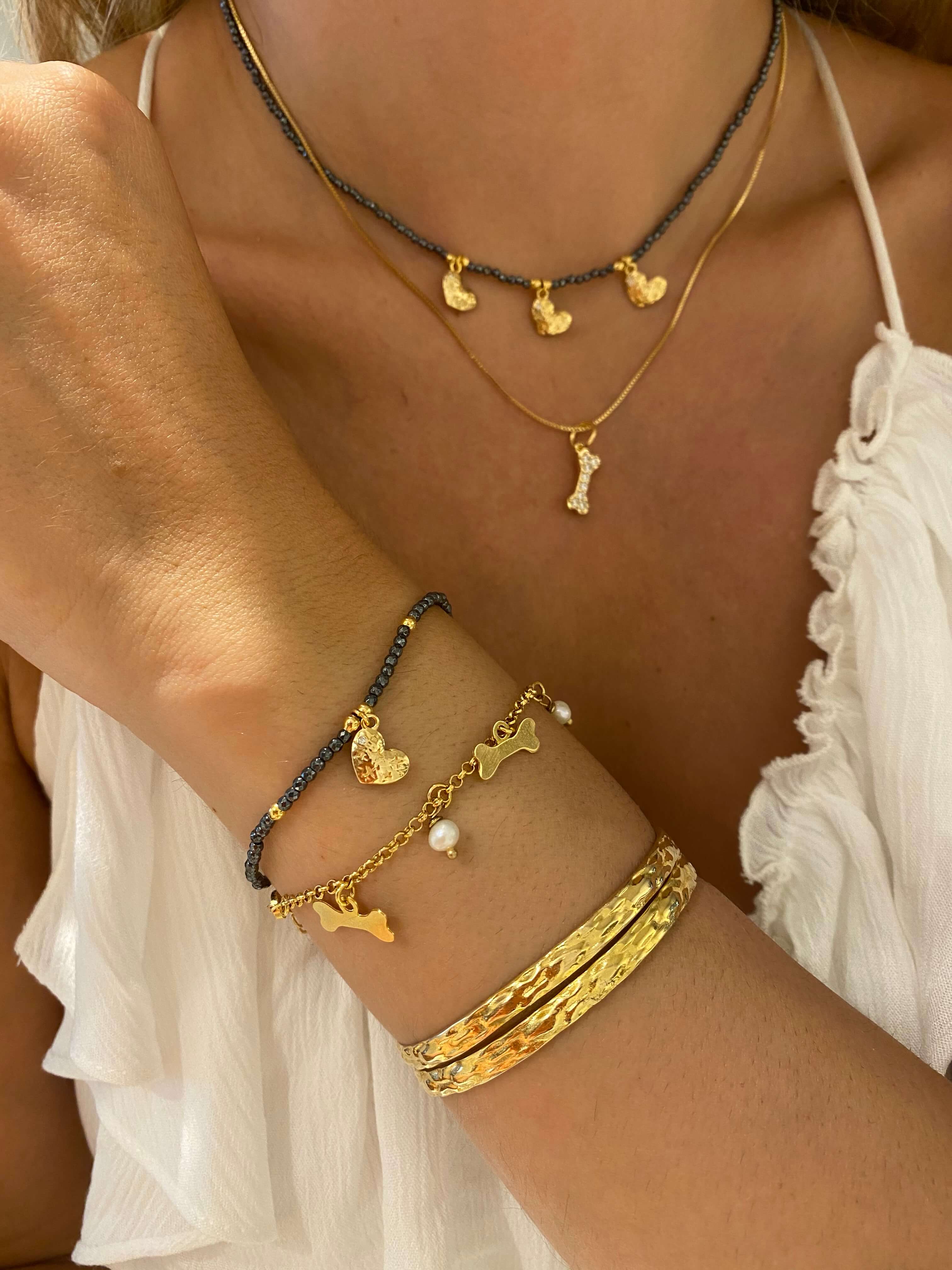PULSEIRA PÉROLA E OSSINHO OURO